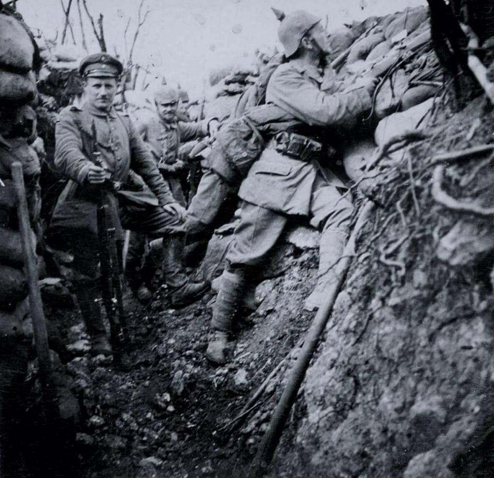 A group of German soldiers posing in a trench, c. 1915. 
