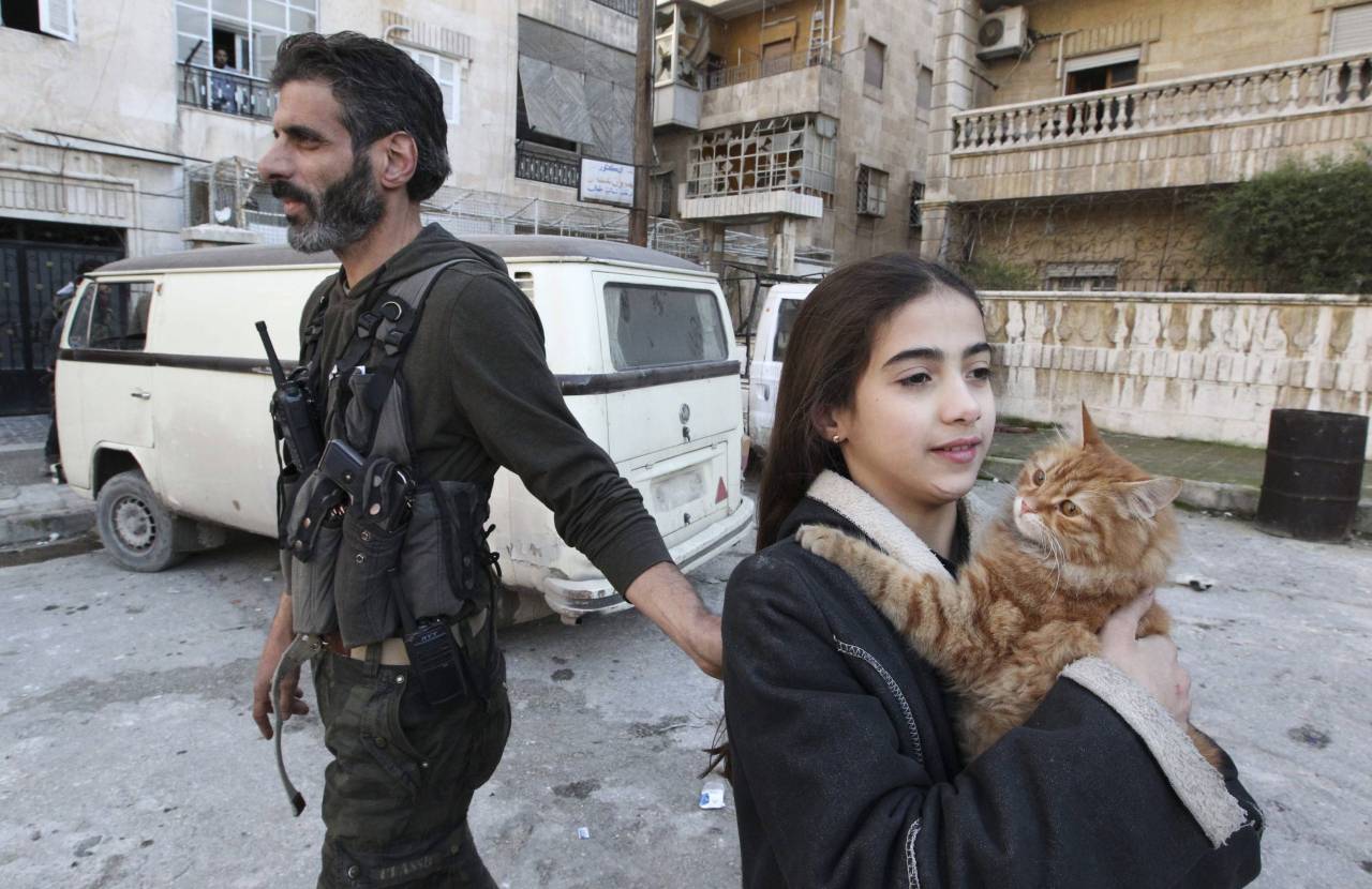 FSA fighter standing next to his daughter.
