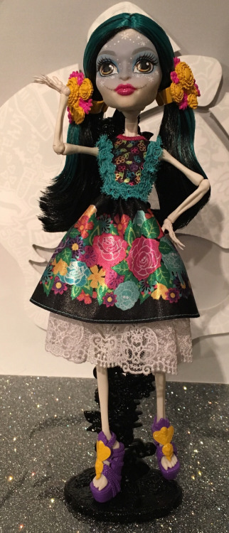momdusa:

bigsamthompson:

zakniteh:

momdusa:

mh-eah:

Skelita Calaveras-Monster High (Toy Fair 2016)
(Edición Especial)

I mean, the only thing is.. she’s no where near as fancy as the Draculaura one. They could’ve gone full La Catrina with the hat, the long dress.. but if she’s that y'all I may just have to customize one me self 

Is this being the Collector Edition doll still just a rumor or has it been verified?

Who said this was a collector’s edition? Definitely doesn’t look like one.
All of the parts of this doll are very cute but when they come together, they clash pretty bad. I’m noticing that’s a trend with a lot of these new dolls; I feel like the color and design pallets are too broad. In this dolls case, I think I would keep the skirt and maybe even the lace underneath but the top would either be plain black or feature a single rose from the skirt design. Then I’d do a lace jacket or collar/sleeves in white or possibly turquoise. The purple shoes don’t match at all; I’d go with the same color of pink on her lips with yellow accents. And finally, I think I’d give her a bit more color on her face. Right now, she looks like she has a snowflake motif which seems weird. (If I’m gonna push it, a tiny pink/yellow ring or bracelet would look nice, too.)
Also, do we know for sure this is Skelita? I don’t think I’ve seen anything that mentions her name. It looks like her but something seems off.
And what’s on her stand? Flowers? 


I saw a post earlier saying it was confirmed on instagram but my phone wouldn’t connect…Anyway, I’m just comparing it to the Draculaura- rooted lashes, the faceup was gorgeous, she’s got her little unbrella and her dress was super intricate and detailed (not that the lace skulls aren’t rad). The hair on Skelita is a little boring, the dress is pretty but nothing like Lala’s gown. Now- imagine a special collectors edition Skelita thats more like: orOk I don’t feel like looking for alll the pics I took. Sorry I just think a special edition doll should look a little more… I dunno, special? But if its just a new version of her, she’s alright. (Feel free to ignore me I have a lot of feelings about Skelita K?)