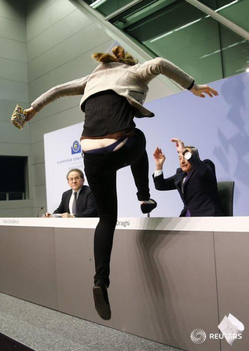 nkym:

Twitter / reuterspictures: A protester jumps on the table...