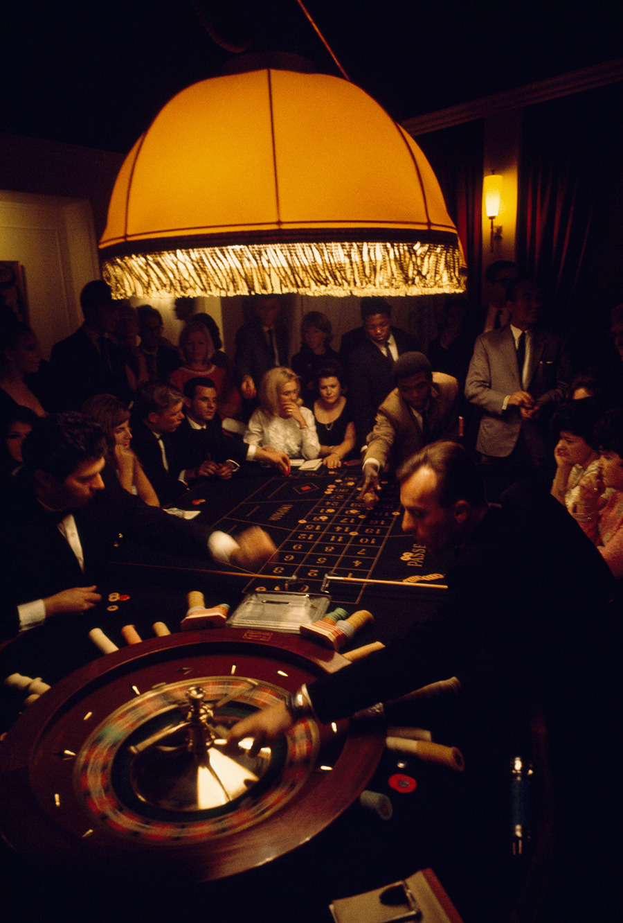 Visitors of diverse nationalities crowd a casino roulette table in Swaziland, 1969.Photograph by Volkmar K. Wentzel, National Geographic Creative