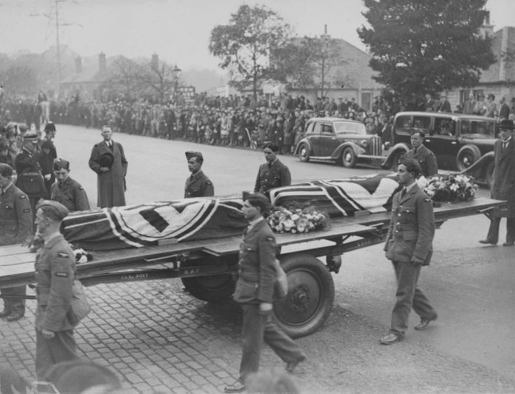 Full final honors for fallen enemies: A Royal Air Force procession escorts the remains of two German pilots, August Schleicher and Kurt Seydel, whose Ju-88 bomber was shot down during a raid upon a naval base on the coast of Scotland on Oct 16, 1939. The funeral was conducted in Edinburgh on Oct 21,1939. Note how both coffins are wrapped in the swastika flag.