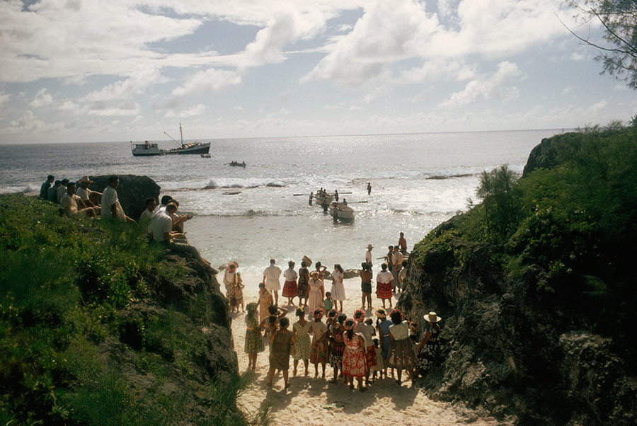 The arrival of a supply boat draws a crowd to the beach on Mauke Island in New Zealand, 1967.Photograph by William Albert Allard, National Geographic Creative