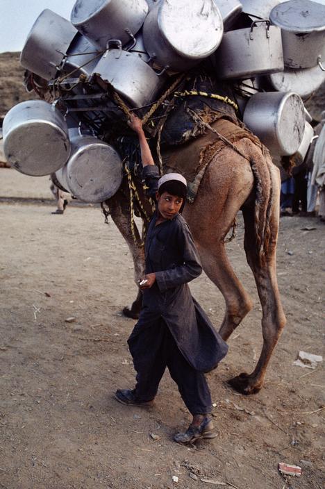 salamalaikum:

Steve McCurry
AFGHANISTAN. Kabul. 1988. Afghan boy takes cooking pots from the market back to their village.
