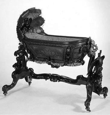 derwandelndegeist:
Crown Prince Rudolph’s cradle. Made by Franz Matthias Podany from mahogany, maple
and bronze mounts in 1858.