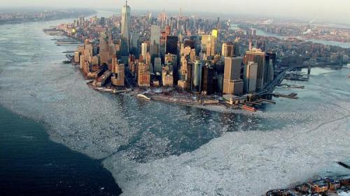 laughingsquid:A Stunning Aerial Photo of Manhattan Island Surrounded By the Frozen Waters of New York Harbor