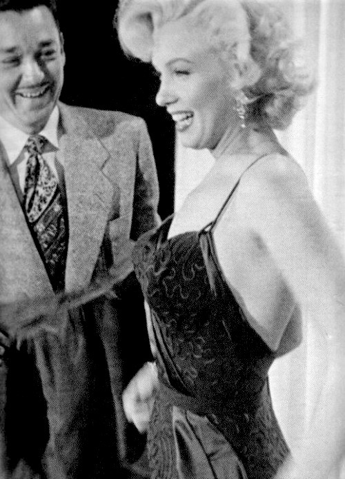 Marilyn and Costume Designer William Travilla during the production of Gentlemen Prefer Blondes in 1953. 