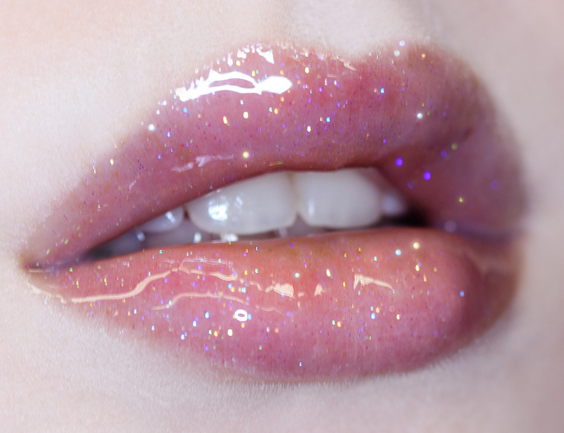 limecrime:

Snowsicle Gloss, $16.99. SHOP
Season’s best-seller, SNOWSICLE is a clear gloss packed with rainbow sparkle. Wear alone or over your favorite lipstick for a Holiday spin!
