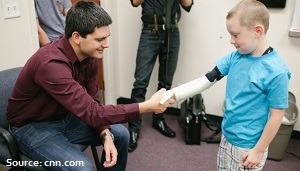 Albert Manero shakes hands with the first recipient of Limbitless' 3D-printed bionic arm.