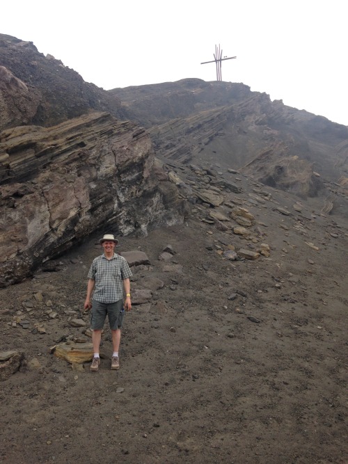 Mike Labbé, CEO of Options for Homes, in front of the rocky side of the Masaya Volcano.