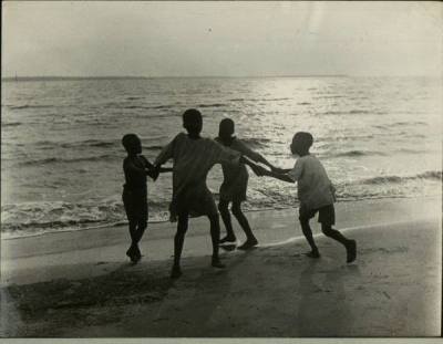 Children playing on a beach, 1940s