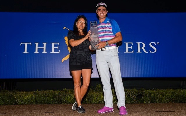 Rickie Fowler and his mom hoist trophy