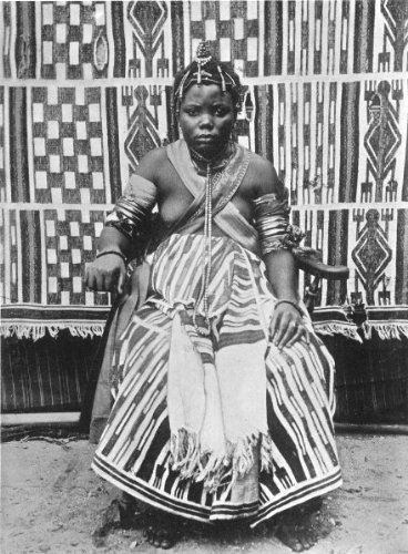 A Nigerian Bride, 1900The clothes worn by the bride, the daughter of one of the most important chiefs in the oil rivers protectorate, now Southern Nigeria, is of native manufacture. Some of these cloths are very beautiful and exceedingly strong. The necklets, bracelets and hair ornaments are large pipes of real and valuable coral. The armlets are of ivory cut from elephants&rsquo; tusks&rsquo;Vintage Nigeria